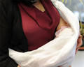 Infants can suffocate in this position against the caregiver's body or the sling
