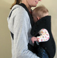 A baby is at a greater risk of suffocation in this position against the caregiver's or parent's body